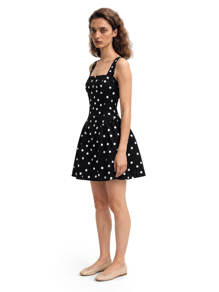 Polka-dot dress on a model, three-quarter