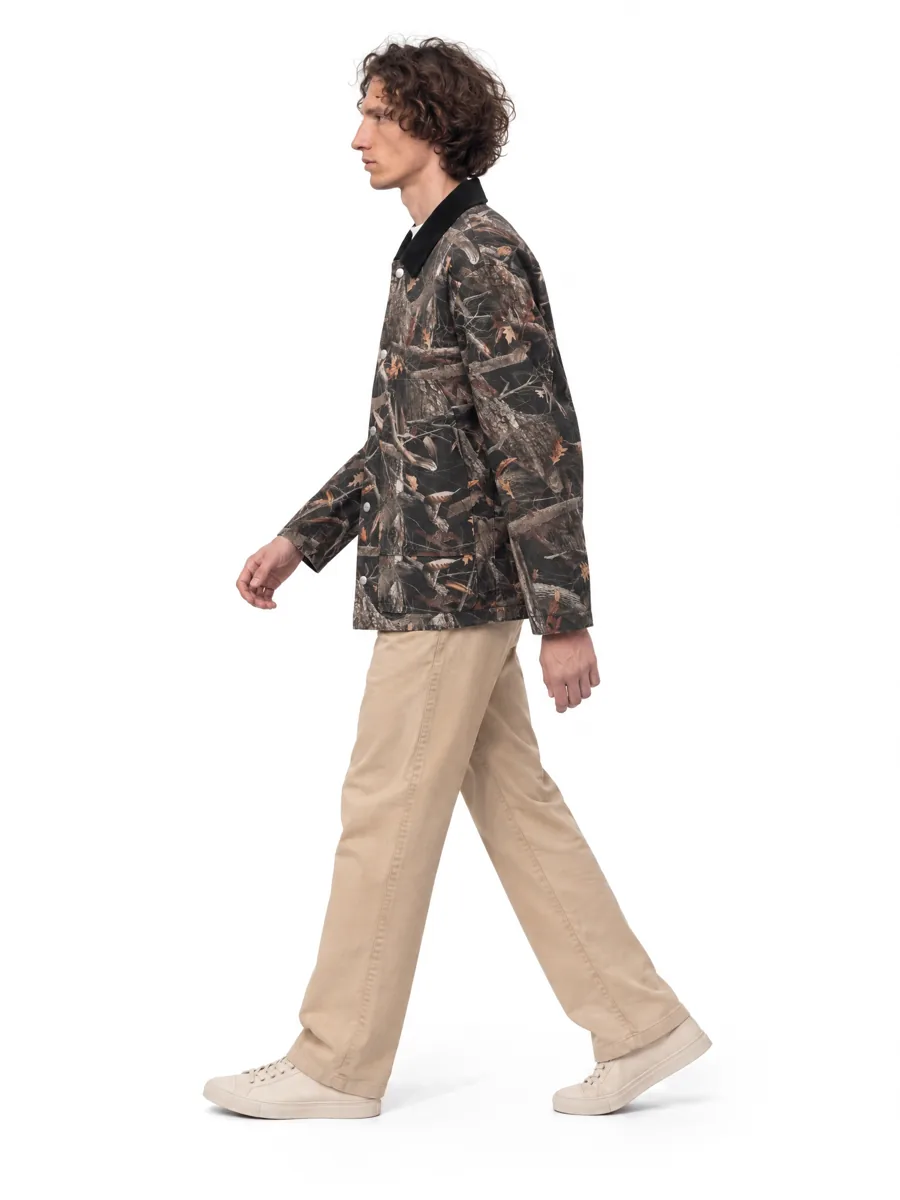 Camo jacket on a model, profile, walking